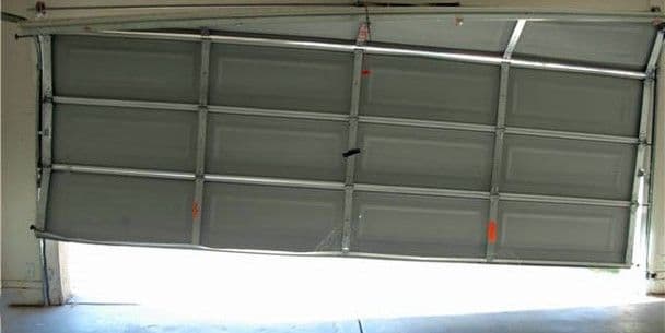 Blog post Title: Oh No! My Garage Door is Off-Track: What to Do (and What NOT to Do) image