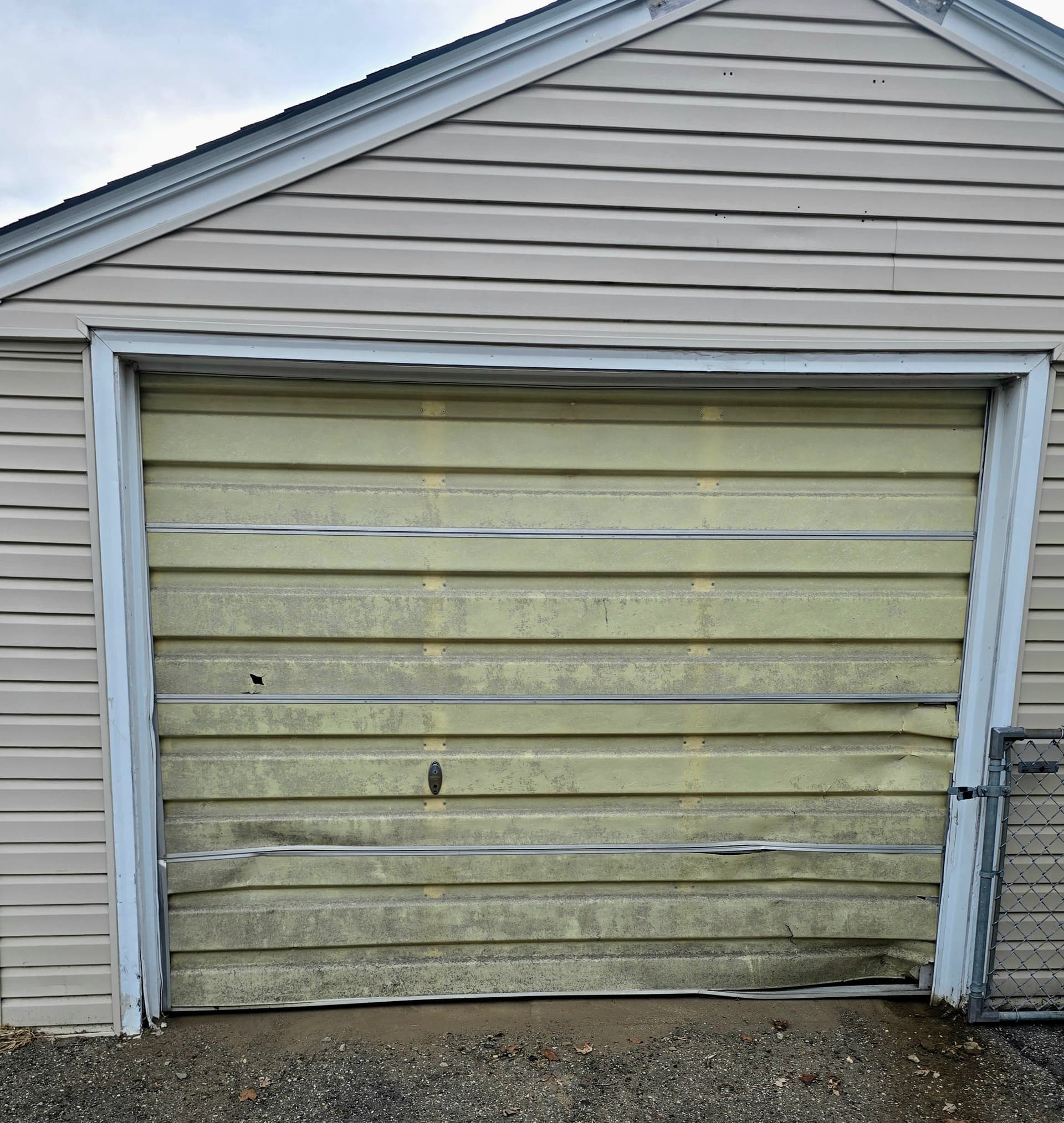 Dented and Worn Out Garage Door Gets a Full Replacement in Bloomington image